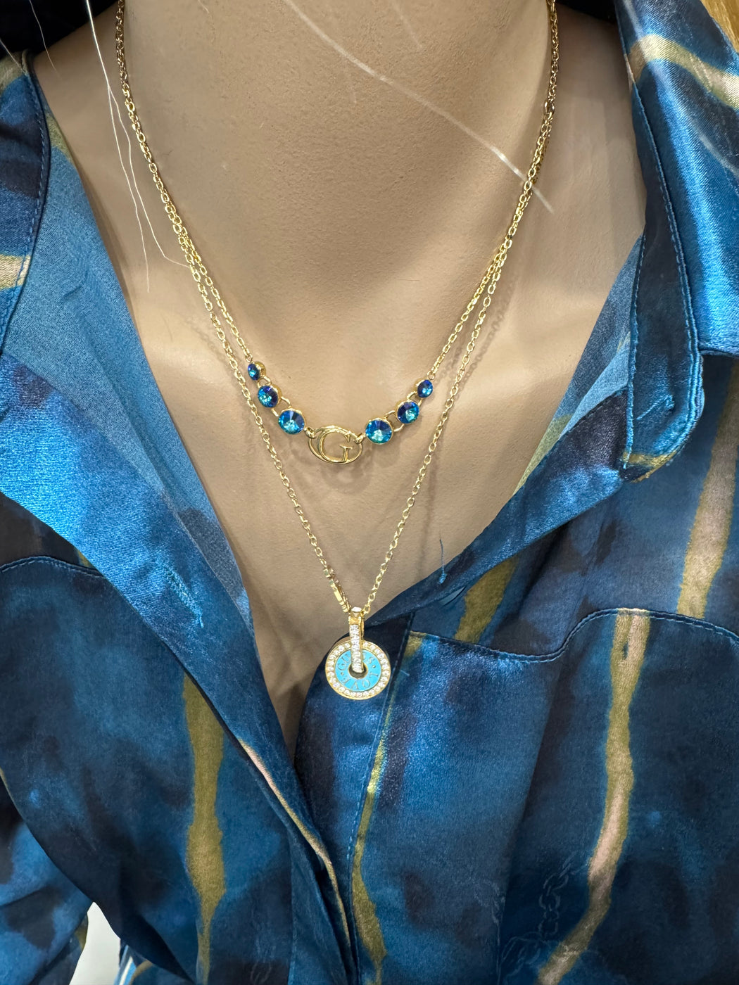 JUBN04077 guess gold blue necklace