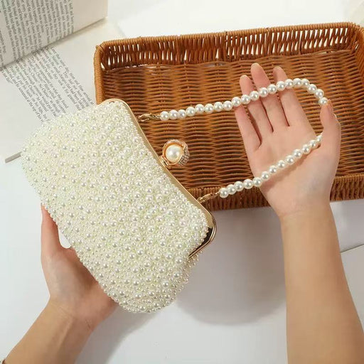 25945 pearl ivory clutch